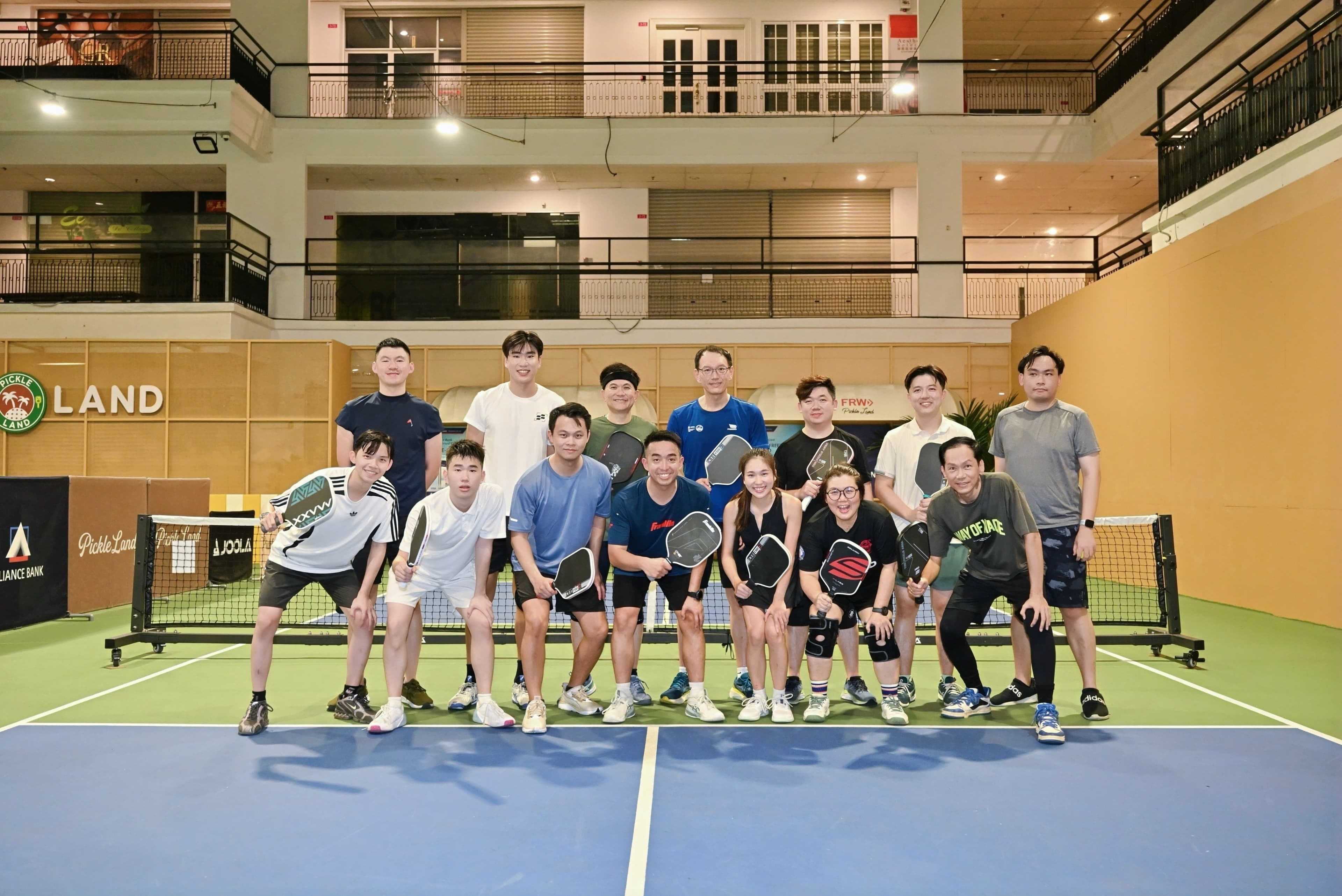 CEO Sports Club players gathered on a Pickle Land court