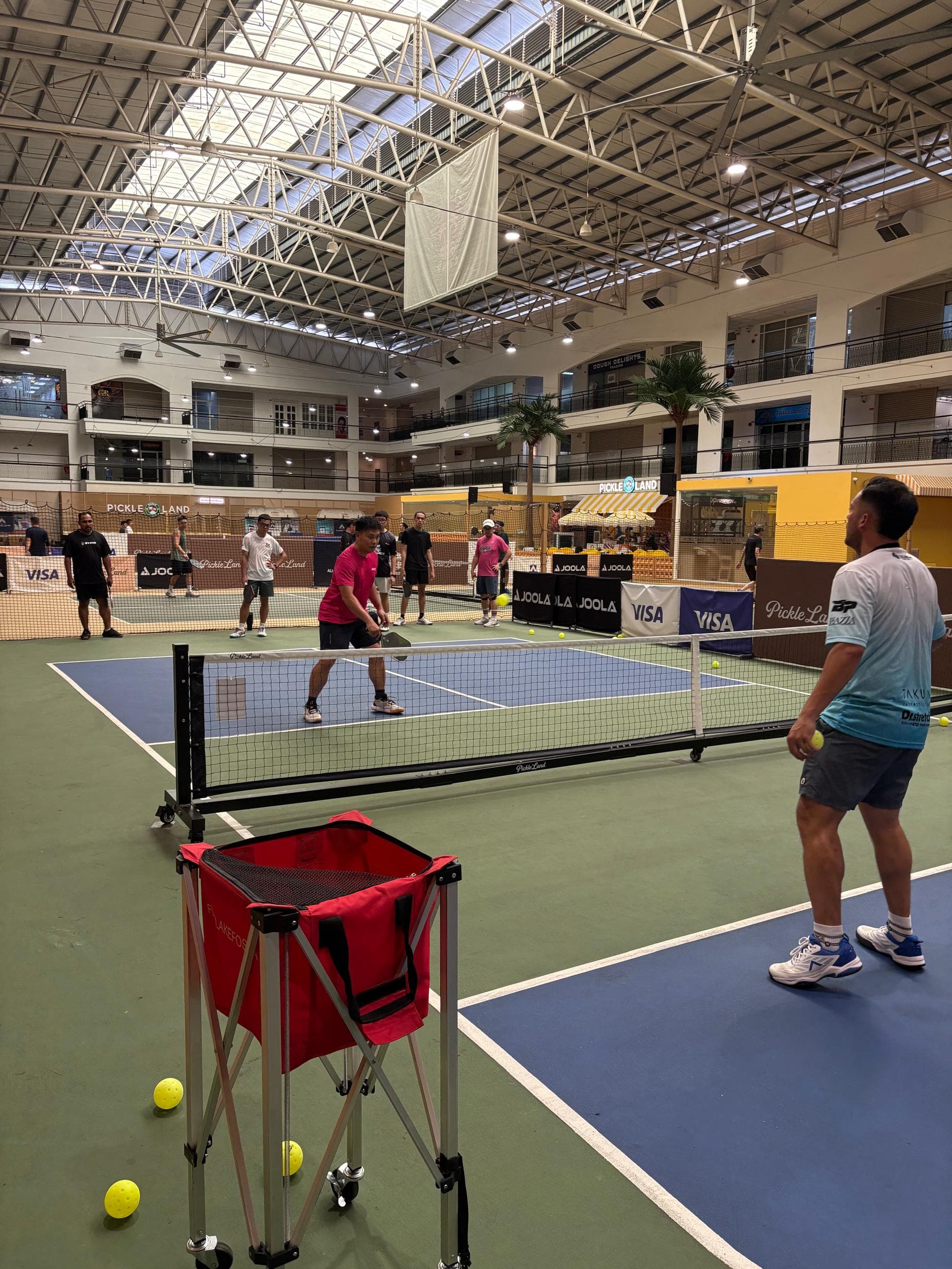 Players standing together during a pickleball session at Pickleland
