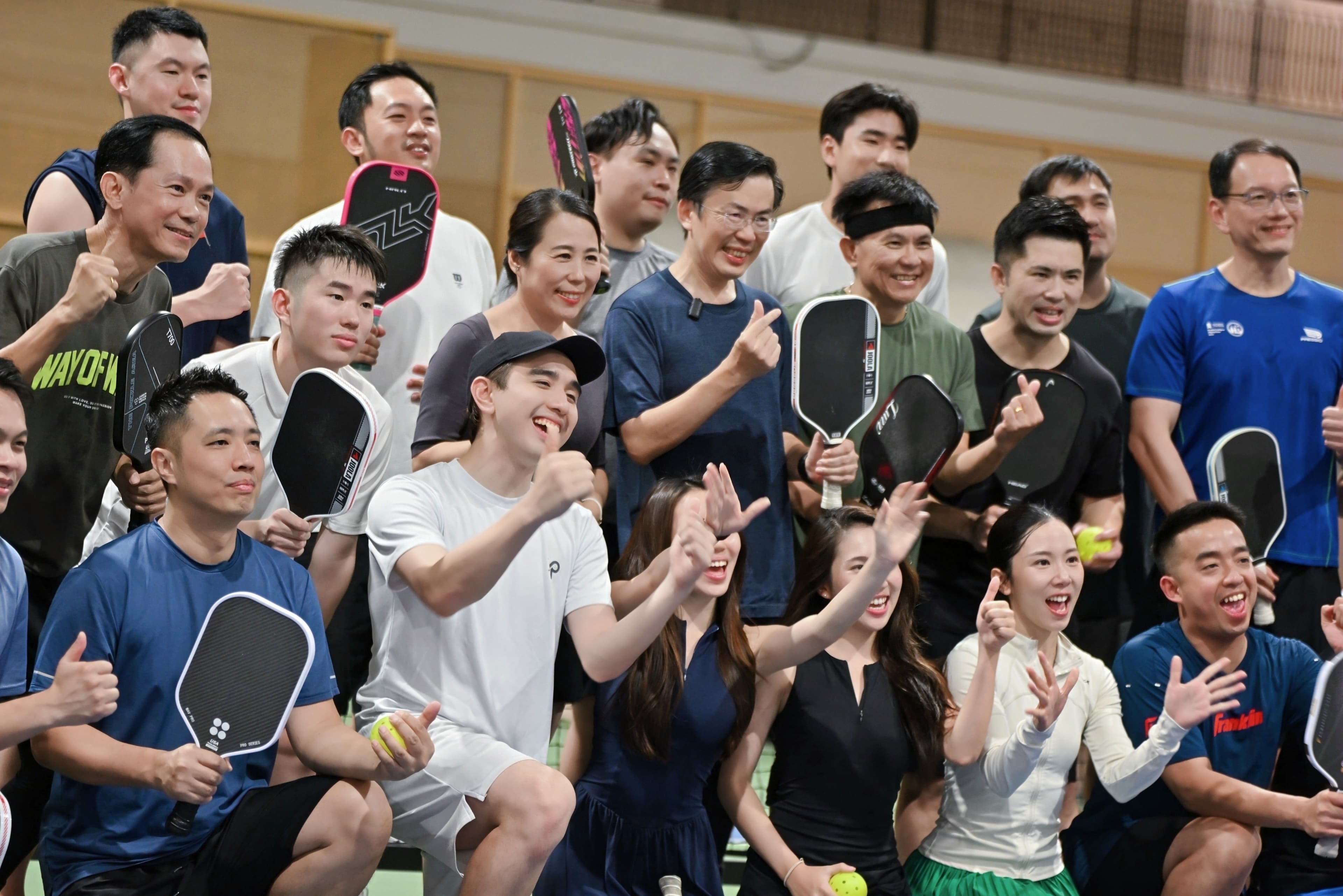 CEO Sports Club guests celebrating together on court