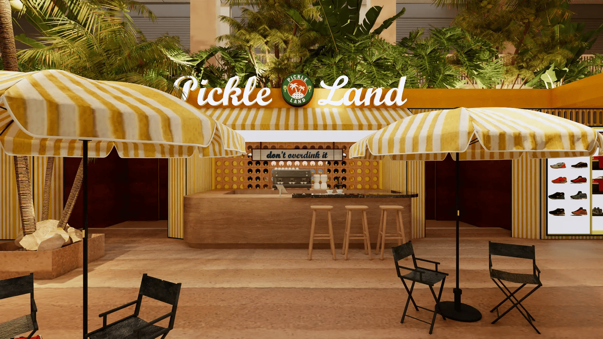 Pickle Land entrance with striped umbrellas, palms, and the venue sign